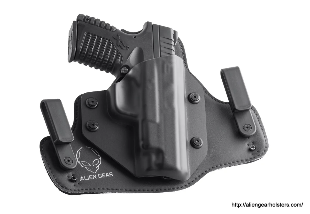 Hybrid inside-the-waistband concealed carry holster holding a compact pistol
